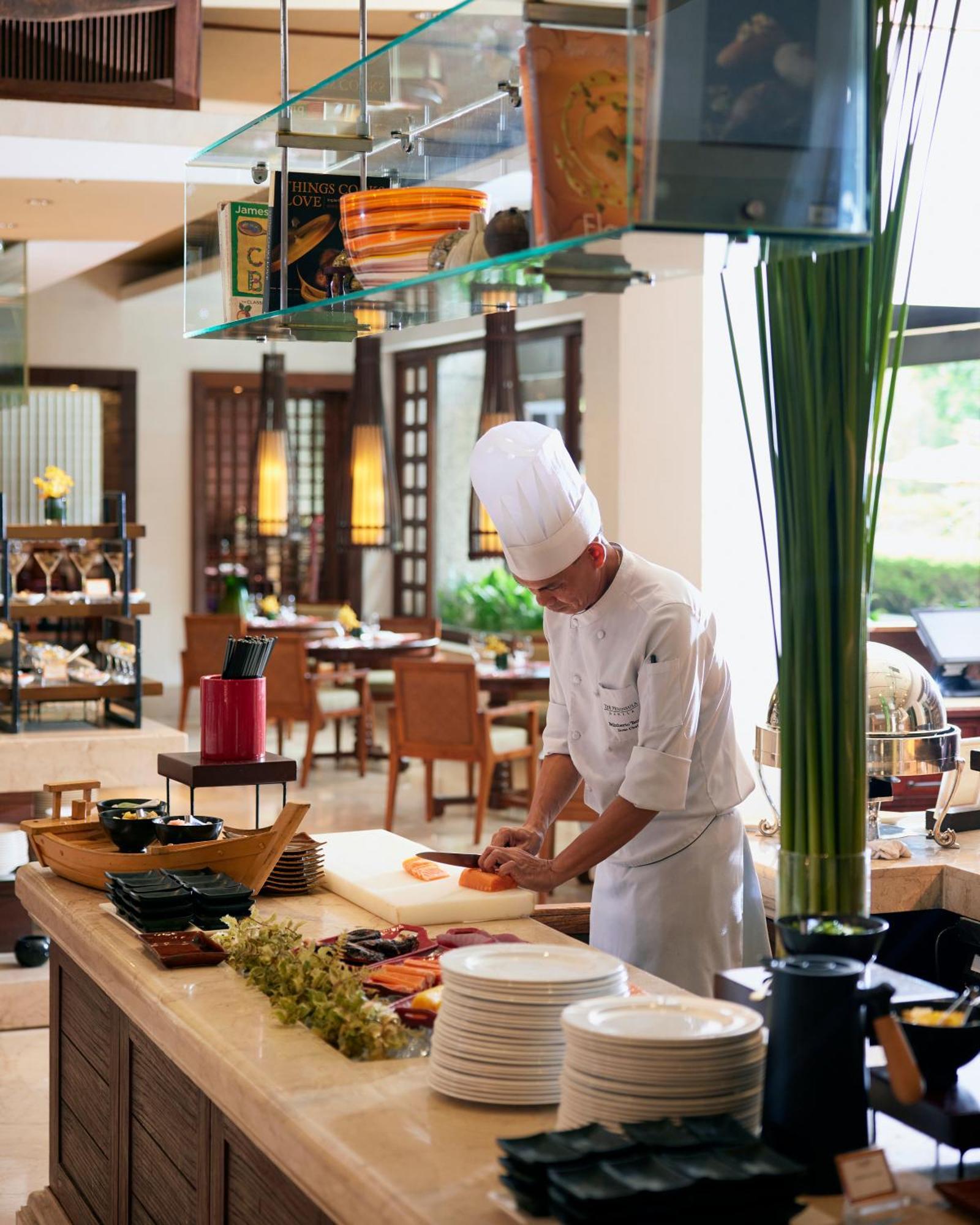 The Peninsula Manila Hotel Makati City Exterior photo A chef at work